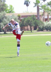 RSL-AZ soccer player kicking the ball towards the goal.